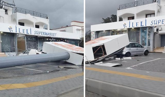 Alsancak’ta market tabelası araçların üzerine devrildi